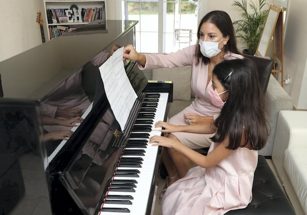 Mercedes at piano